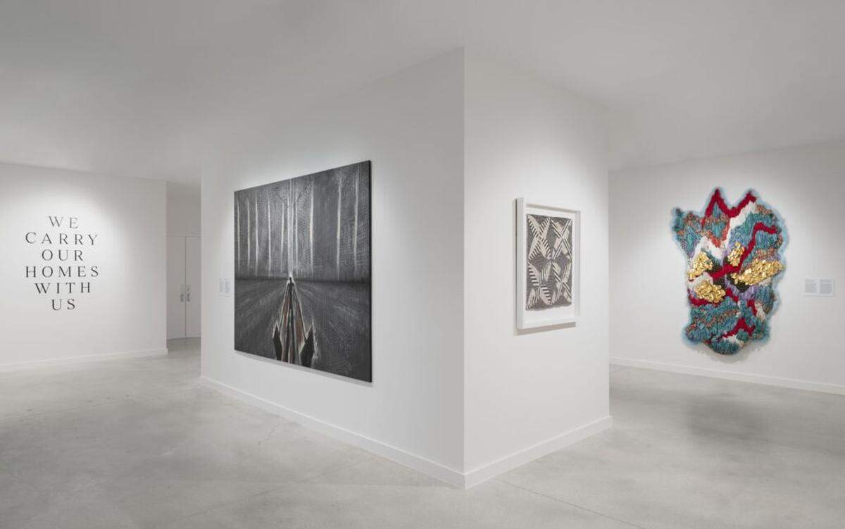 “We Carry Our Homes With Us” takes its name from the memoir by Cuban-American author Marisela Vega, who immigrated to the U.S. through Freedom Tower.