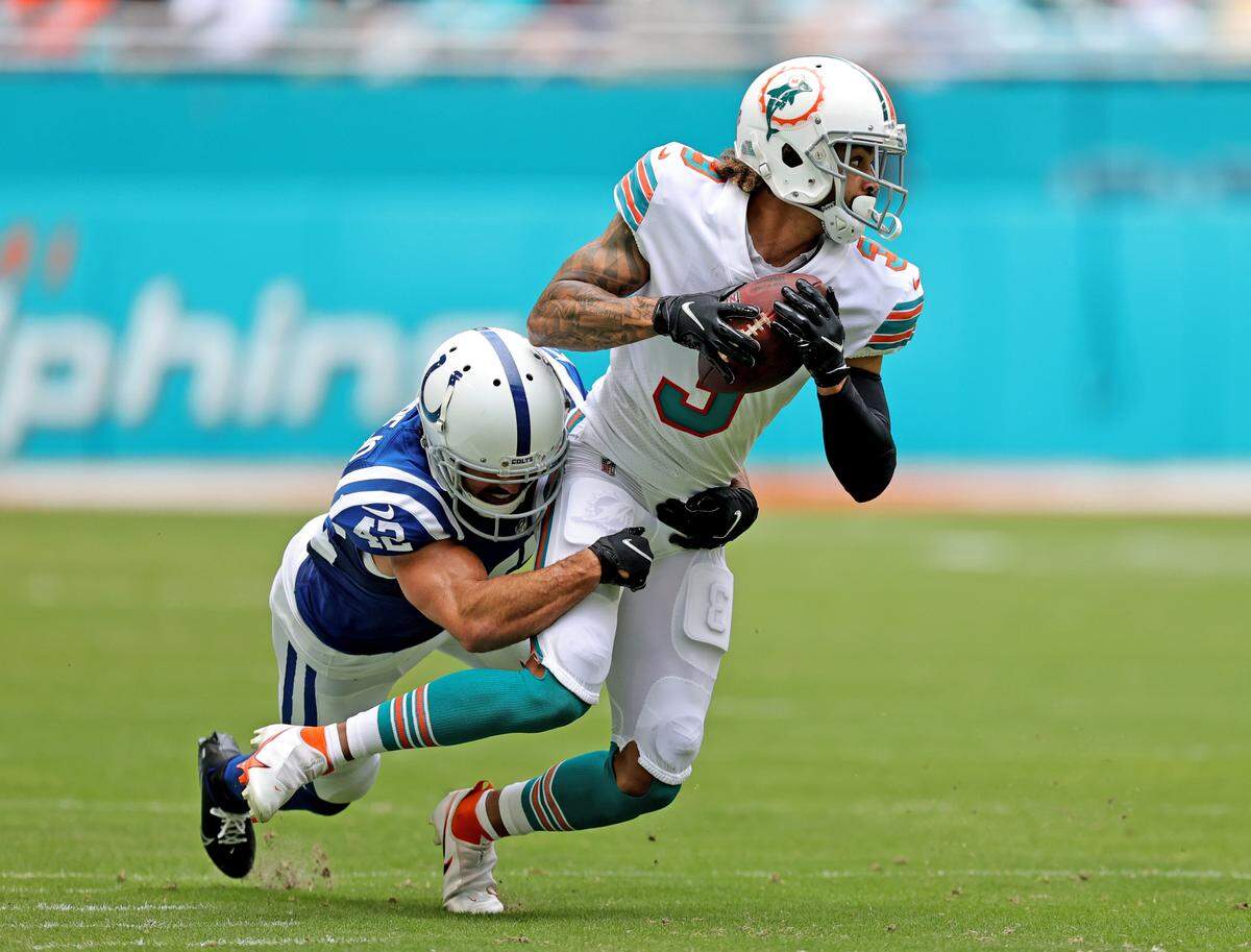 Miami Dolphins wide receiver Will Fuller (3) runs with the ball againstIndianapolis Colts defensive back Rolan Milligan (42) during first quarter of an NFL football game at Hard Rock Stadium on Sunday, October 3, 2021 in Miami Gardens, Florida.