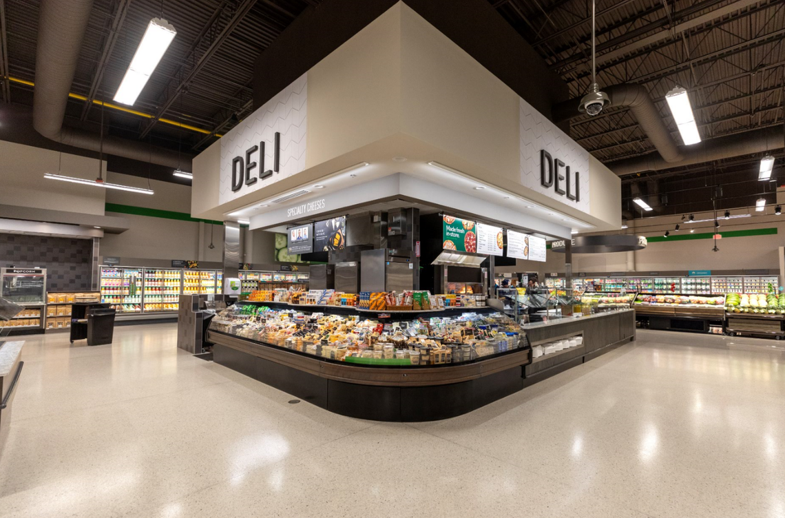 Photo of the deli from a new Publix opening in Kentucky. A burrito area that also serves pizza and drinks and seating is adjacent to the deli.
