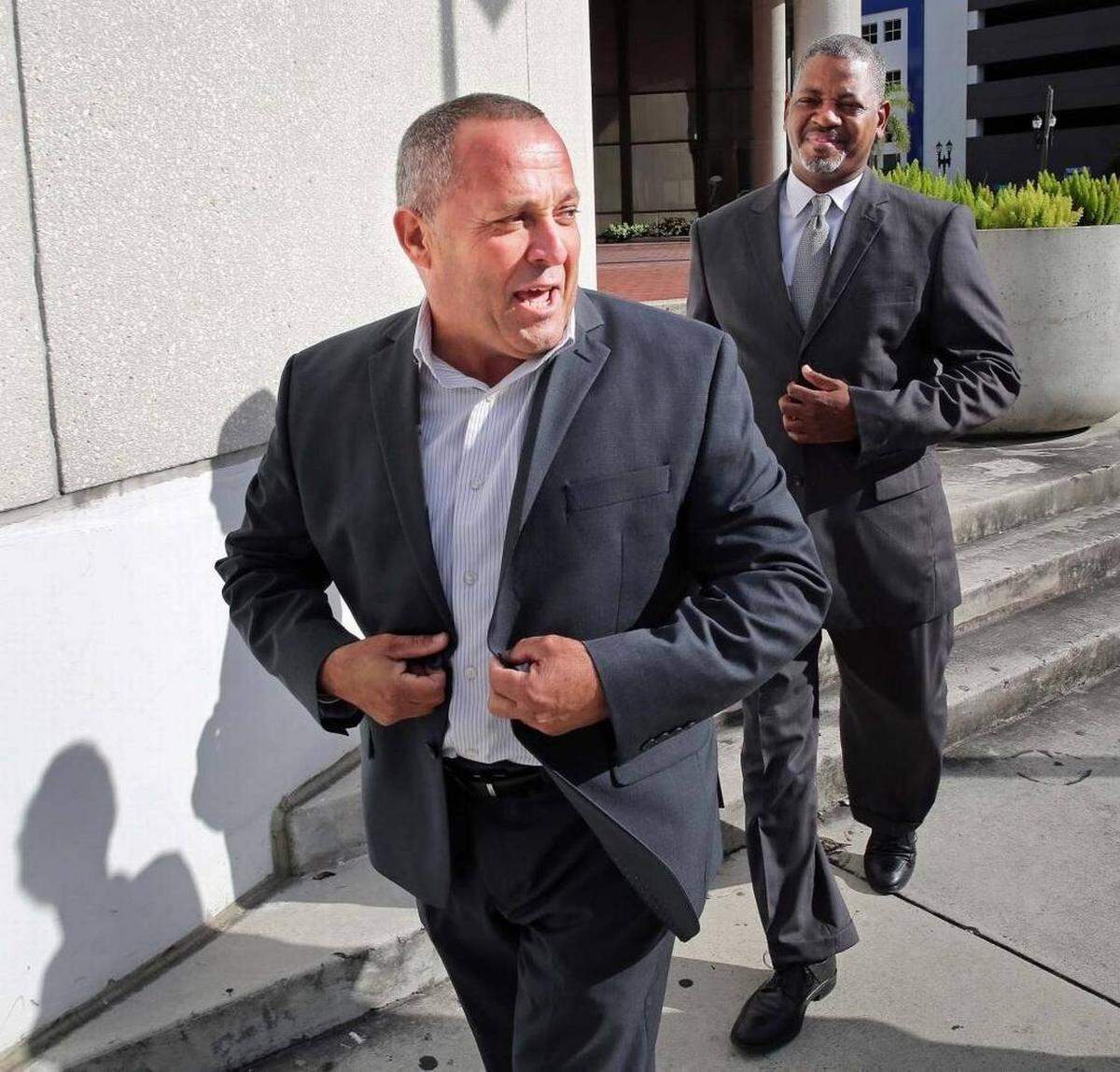 Luis Santiago leaves federal court in Miami after he was charged with accepting bribes as part of Opa-locka's corruption scandal.