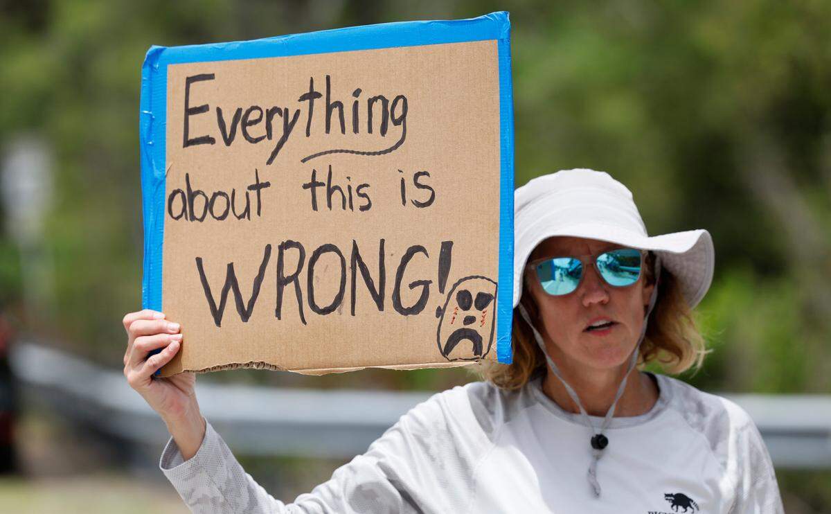 Angel Obrochta protest outside Alligator Alcatraz as Florida lawmakers and members of Congress tour the facility within the Florida Everglades. The detention facility is 36 miles west of the central business district of Miami, in Collier County, Florida Saturday, July 12, 2025.