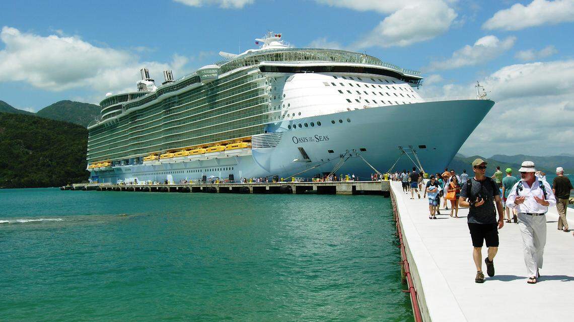 Five crew members with COVID-19 symptoms have been medically evacuated from the Oasis of the Seas in the last week. Here, the Oasis of the Seas os docked for a beach day at Labadee, Haiti in 2012.