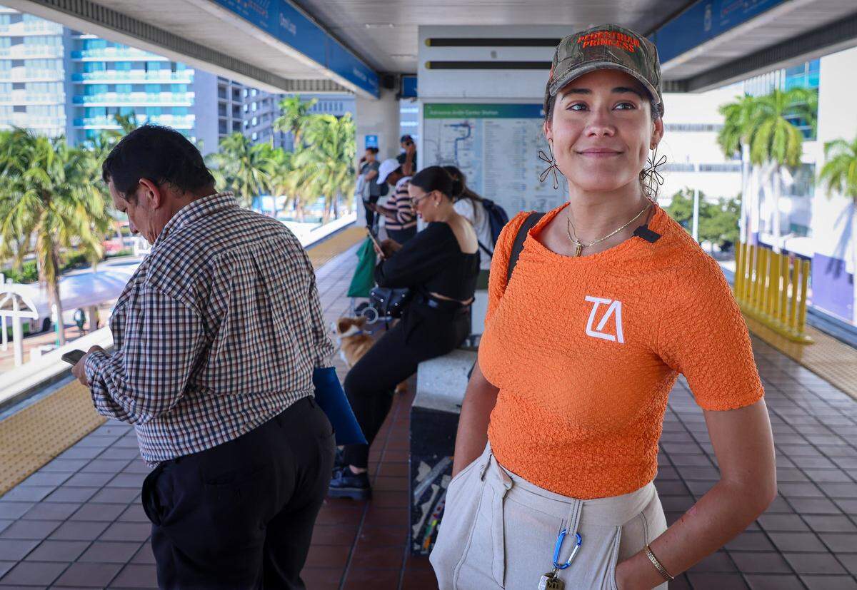 10:00 AM - Executive director of Transit Alliance Miami, Cathy Dos Santos, stands on the Omni Loop of the People Mover transport to the Government Center. Today her journey from home to her office took over an hour and a half using multiple modes of transit on Tuesday, September 30, 2025 in Miami-Dade, Florida.