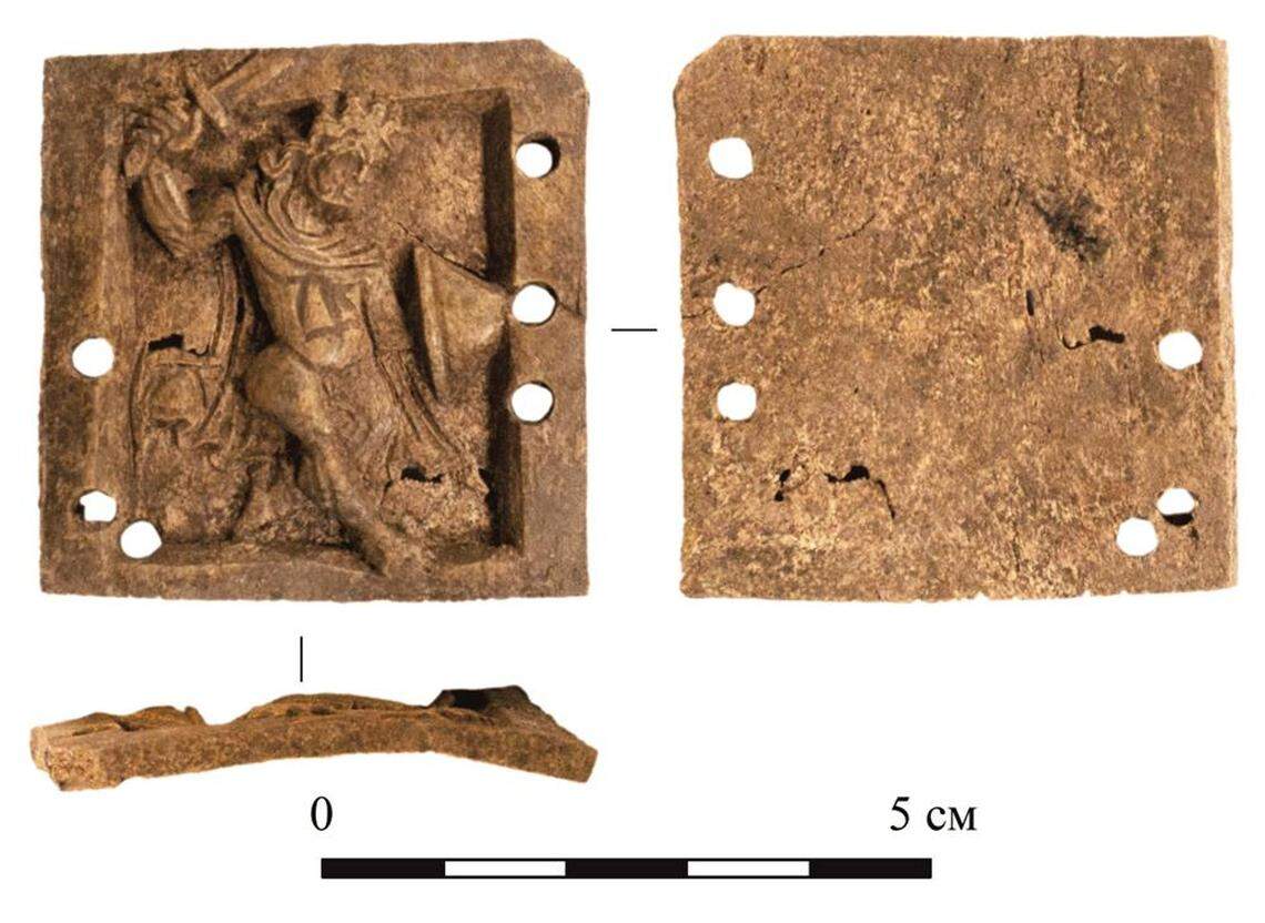 The bone plate depicts a naked warrior armed with a shield and sword at the moment of attack, researchers said.