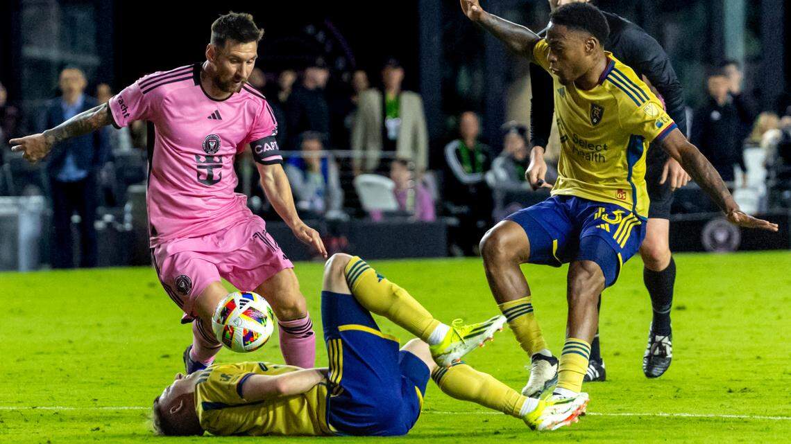 Inter Miami forward Lionel Messi (10) kicks the ball over Real Salt Lake defender Andrew Brody (2) in the first half of an MLS match at Chase Stadium on Wednesday, Feb. 21, 2024, in Fort Lauderdale, Fla.