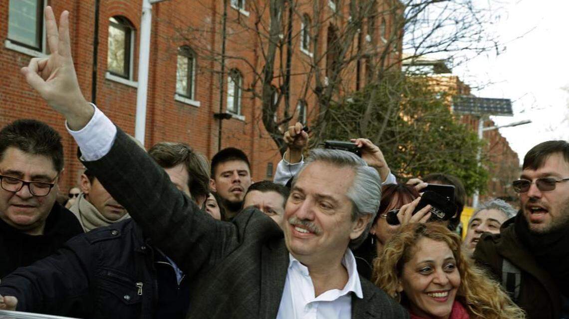 Presidential candidate Alberto Fernandez flashes the V sign after voting in Argentina’s primary elections in August.