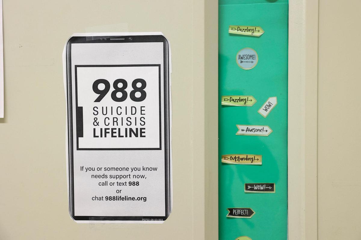 The phone number to the Suicide & Crisis Lifeline is posted on doors at the mental health clinic at North Miami High School in North Miami. Dr. Elizabeth Pulgaron, director of mental health services for the school health initiative at the University of Miami Miller School of Medicine, runs nine clinics in Miami-Dade public schools.