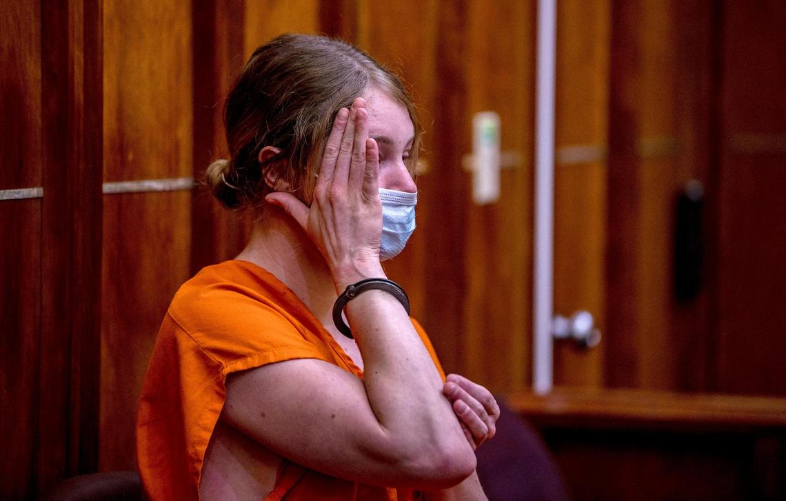 Courtney Clenney covers her face during an evidentiary hearing. She is the OnlyFans model accused of murdering her boyfriend Christian Obumsel last April 03 in Miami. Her defense lawyers were seeking to restrict release of evidence in the case. The Miami Herald and prosecutors oppose the move at the he hearing at the Richard E. Gerstein Justice Building, in Miami, on Tuesday, September 6, 2022.
