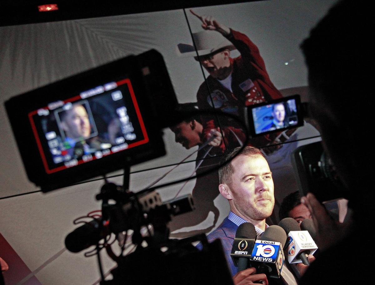 On Sunday, December 23, 2018, Oklahoma football coach, Lincoln Riley, talks to members of the media after players, family, and staff of the University of Oklahoma football team disembarked their charter jet as they arrived to play against Alabama at Hard Rock Stadium in the Capital One Orange Bowl, the 2018 College Football Playoff Semifinals, on December 29, 2018.