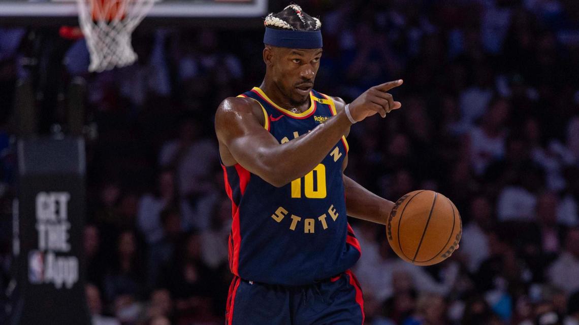 Golden State Warriors forward Jimmy Butler III (10) directs teammates during the first half of an NBA game against the Miami Heat at Kaseya Center on Tuesday, March 25, 2025, in Miami, Florida.