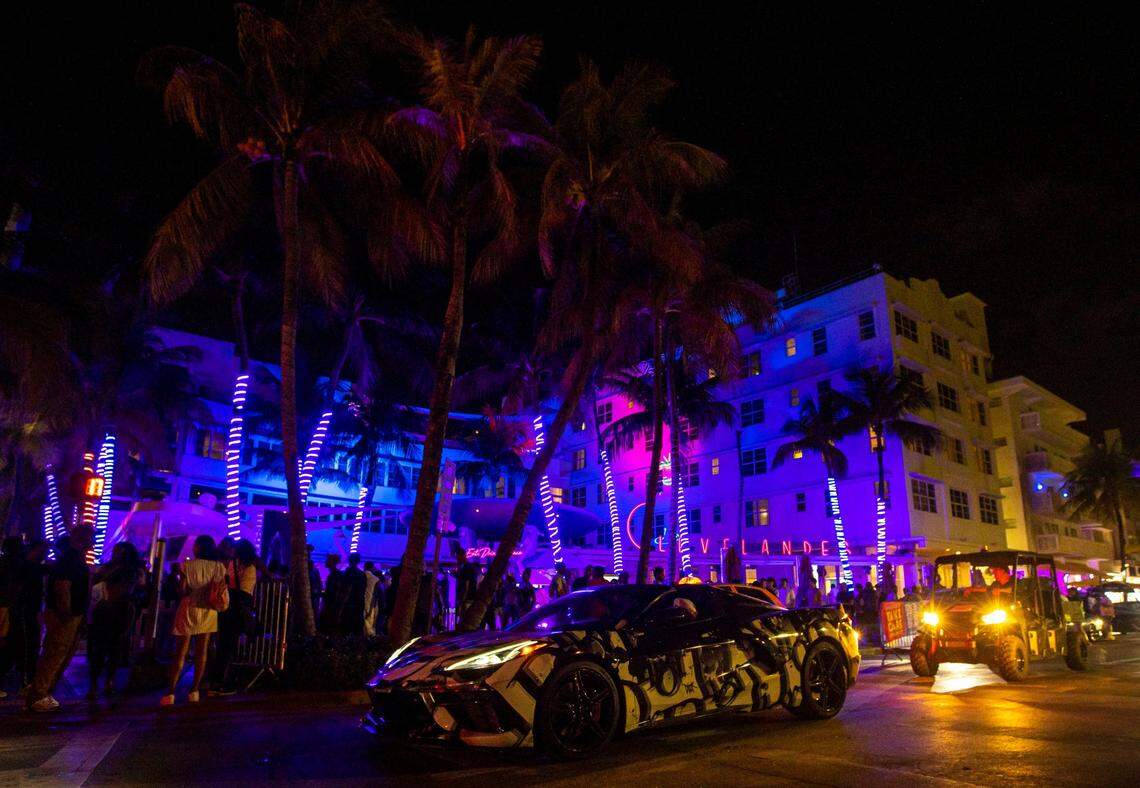Cars and people make their way up and down Ocean Drive during the first day of Memorial Day Weekend in Miami Beach, Florida, on Friday, May 27, 2022.