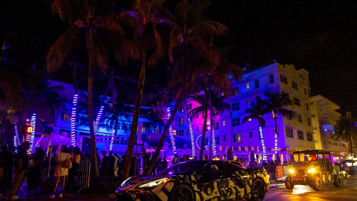 Cars and people make their way up and down Ocean Drive during the first day of Memorial Day Weekend in Miami Beach, Florida, on Friday, May 27, 2022.