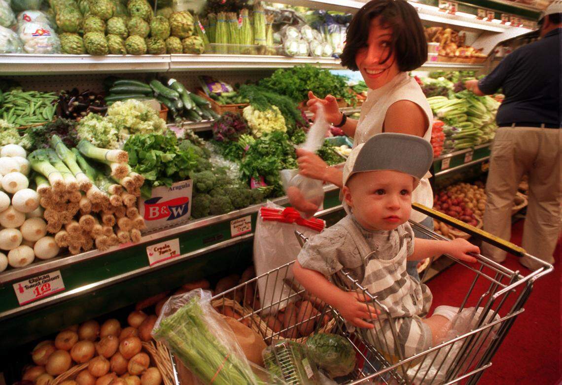 Patrice Curran and 19-month-old son Dylan, of Miami Beach, shopping in Epicure in 1995.