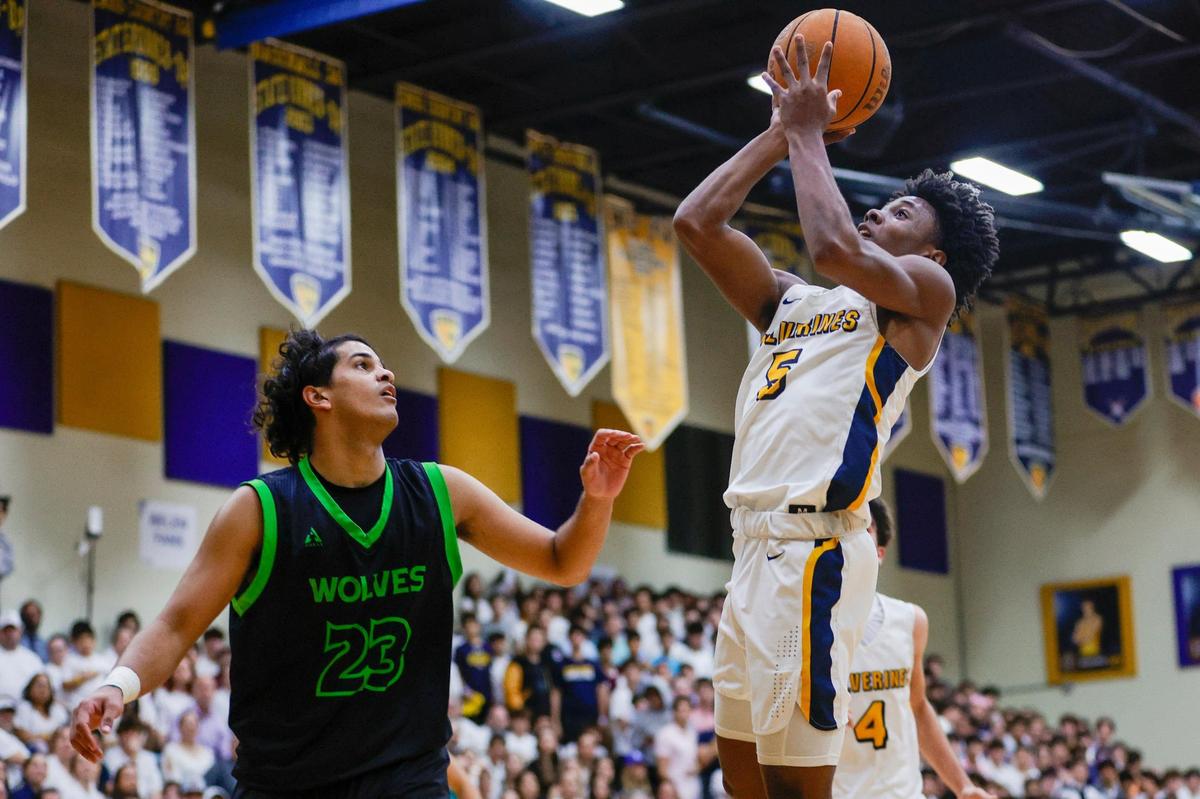 Belen Jesuit Bryce Fitzgerald (5) shoots the ball over TERRA forward Ramiro Pando-tristan (23) during the second quarter of a basketball Region 4-5A quarterfinal game at Belen Jesuit Preparatory School in Miami, Florida on Thursday, February 16, 2023.