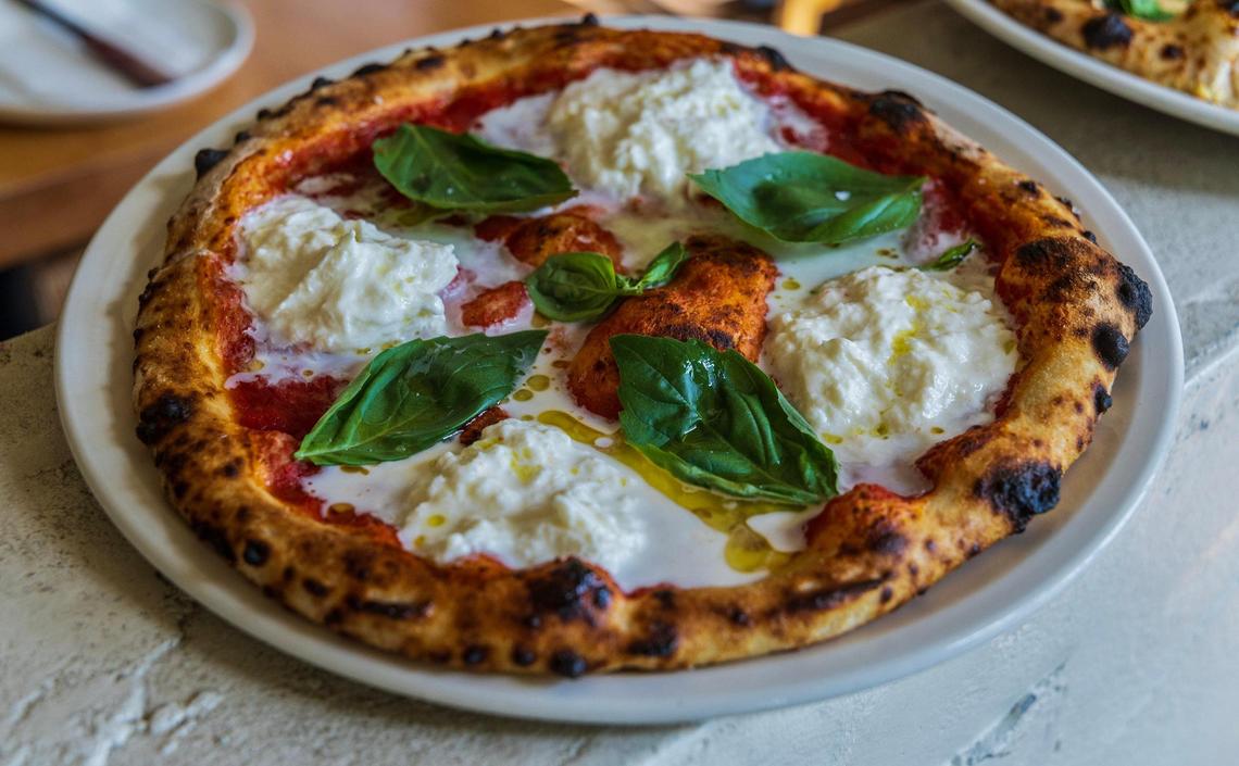A pizza with burrata and basil at La Natural in Little River.
