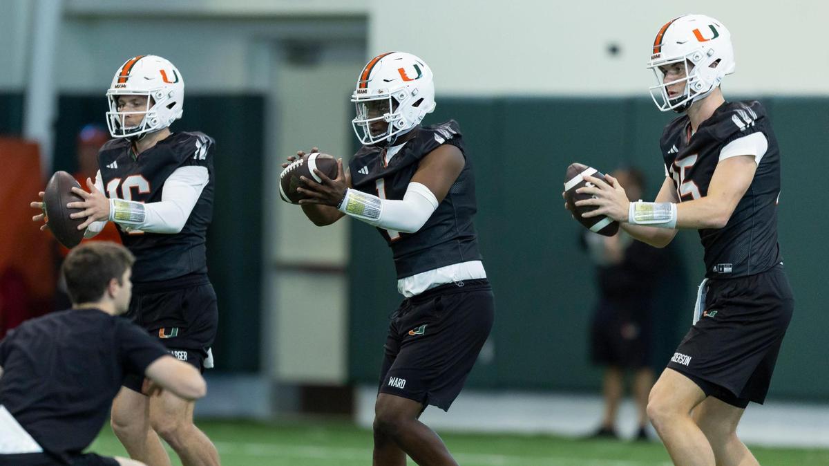 Miami Hurricanes quarterbacks Cam Ward (1), Reese Poffenbarger (16) and Judd Anderson (15) run drills during practice inside the Carol Soffer Indoor Practice Facility at the University of Miami on Monday, March 4, 2023 in Coral Gables, Fla.