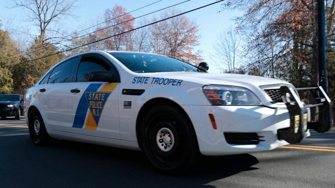 This file photo shows a New Jersey State Police cruiser leaving Trump National Golf Club, Friday, Nov. 18, 2016, in Bedminster, N.J.