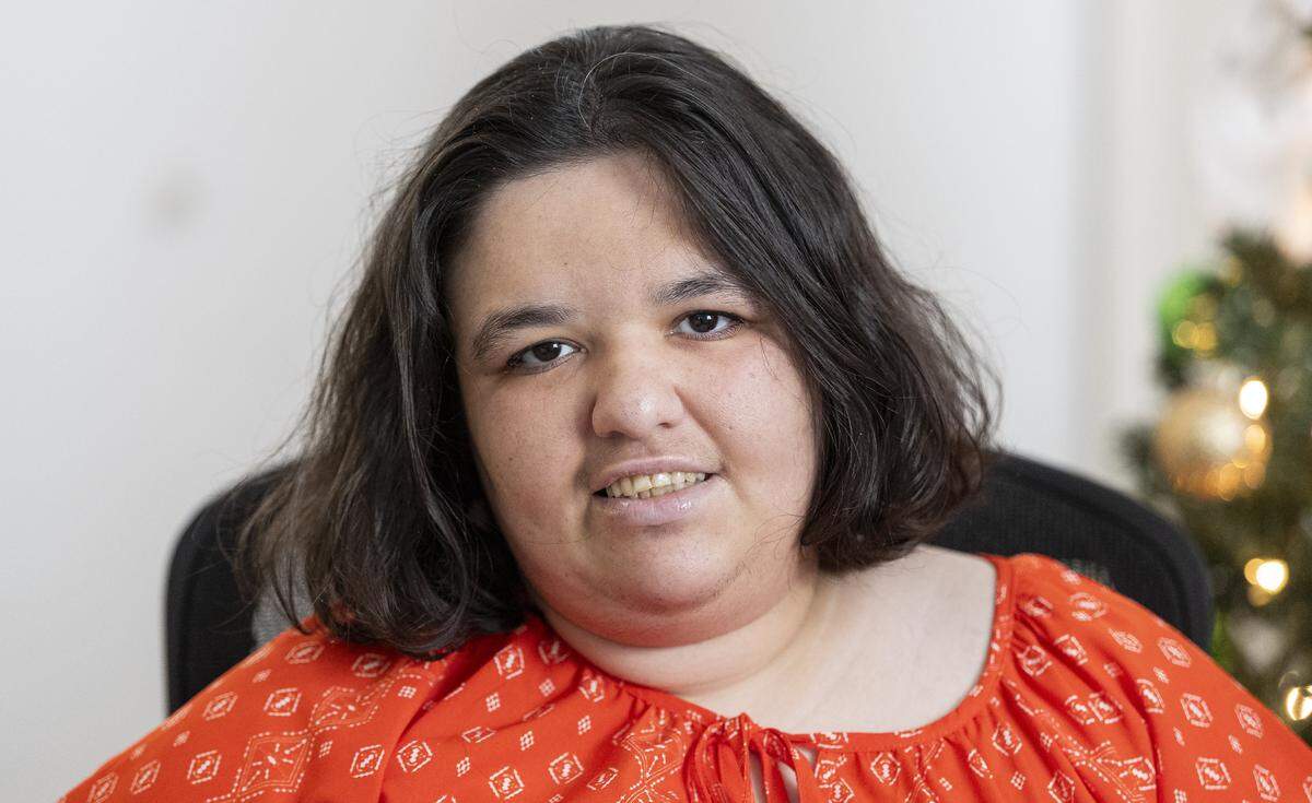 Amanda, 30, is photographed at their home on Friday, Dec. 5, 2025, in Miami, Fla. Amanda, who is a person with autism and a Wish Book participant, is in need of new clothes and any help with groceries.