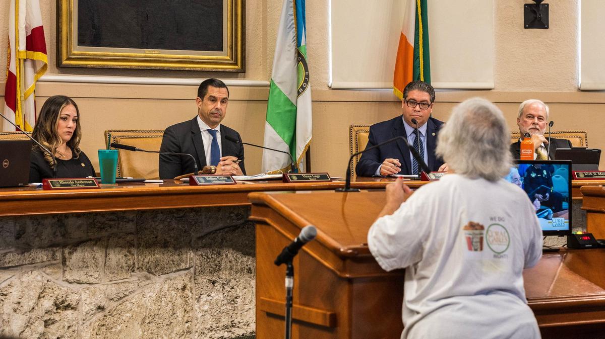 Maria Cruz, chairwoman of the End the Corruption political committee, speaks at the Coral Gables City Commission meeting on April 16, 2024, to Commissioner Melissa Castro, left, Mayor Vince Lago, Commissioner Ariel Fernandez and Commissioner Kirk Menendez.