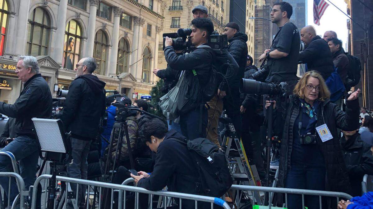 Photographers line up outside Trump Tower on Fifth Avenue hoping to catch a glimpse of something.