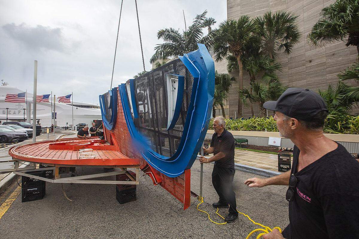 Steve Carpenter, known as “Mr. Neon,” works on the Big Orange installation, a centerpiece of Miami’s NYE tradition, on Friday, December 27, 2024, at the InterContinental Hotel in Downtown Miami.