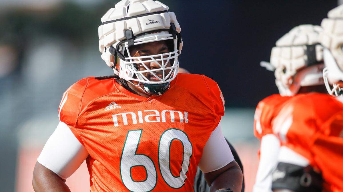 Miami Hurricanes offensive lineman Zion Nelson (60) runs on the field during football practice at the University of Miami campus in Coral Gables, Florida, Tuesday, August 30, 2022.
