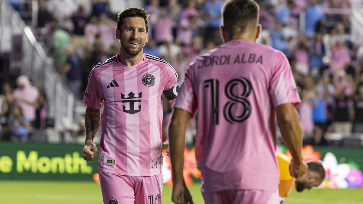 Inter Miami forward Lionel Messi (10) celebrates with defender Jordi Alba (18) after he scored a goal against the Seattle Sounders in the first half of their MLS match at Chase Stadium on Tuesday, Sept. 16, 2025, in Fort Lauderdale, Fla.