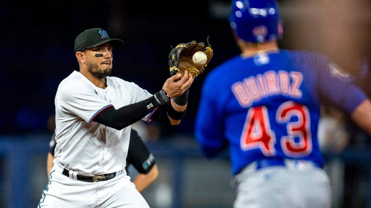 Miami Marlins short stop Miguel Rojas (11) catches the ball before throwing to first base for the double play during the first inning of an MLB game against the Chicago Cubs at loanDepot park in the Little Havana neighborhood of Miami, Florida, on Tuesday, September 20, 2022.