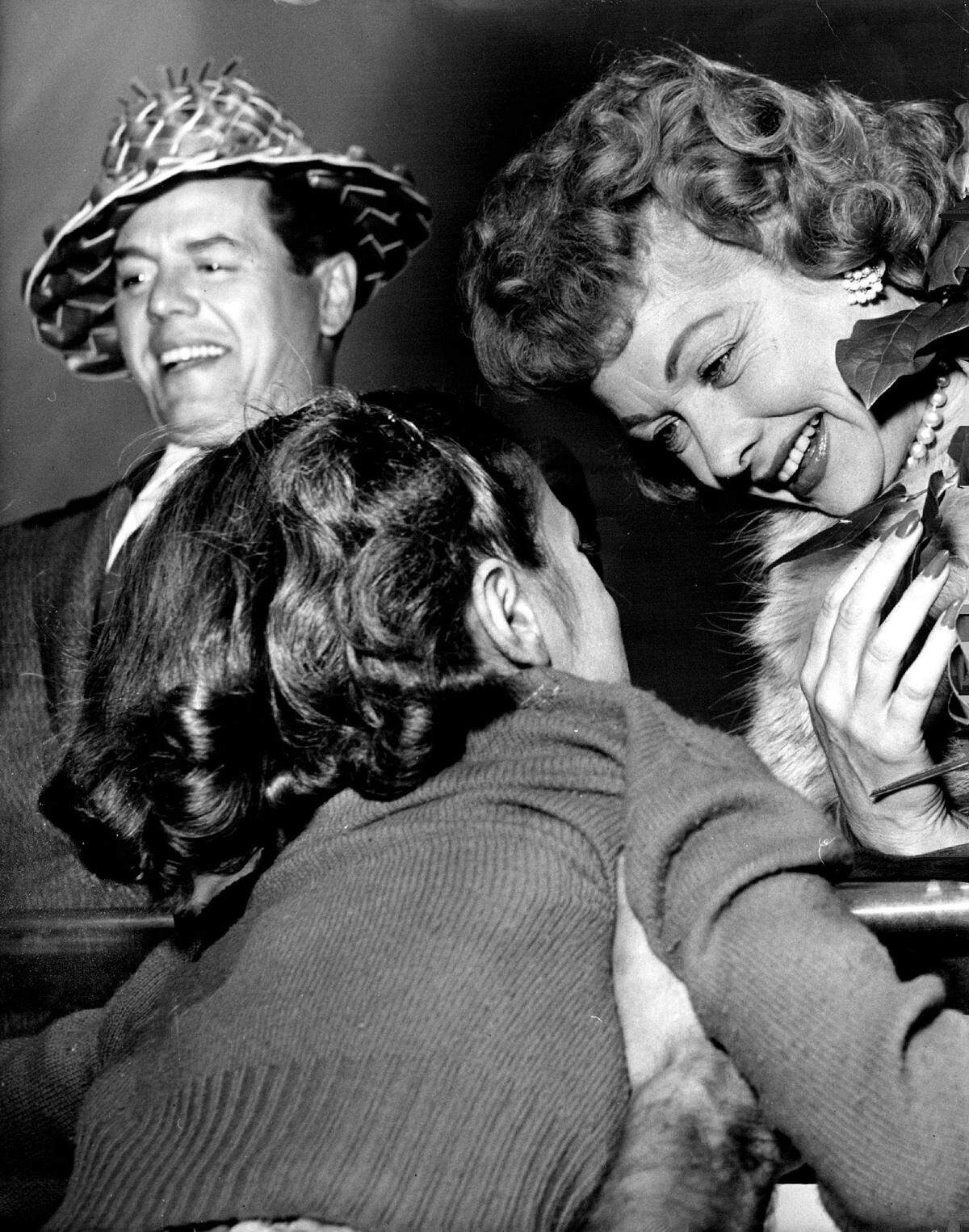 Captivating Charm - of Love Lucy stars was demonstrated Sunday when this unidentified little girl and about 5,000 other persons welcomed Lucille Ball and Desi Arnaz at Miami International Airport. The entire cast will be here until Thursday morning.