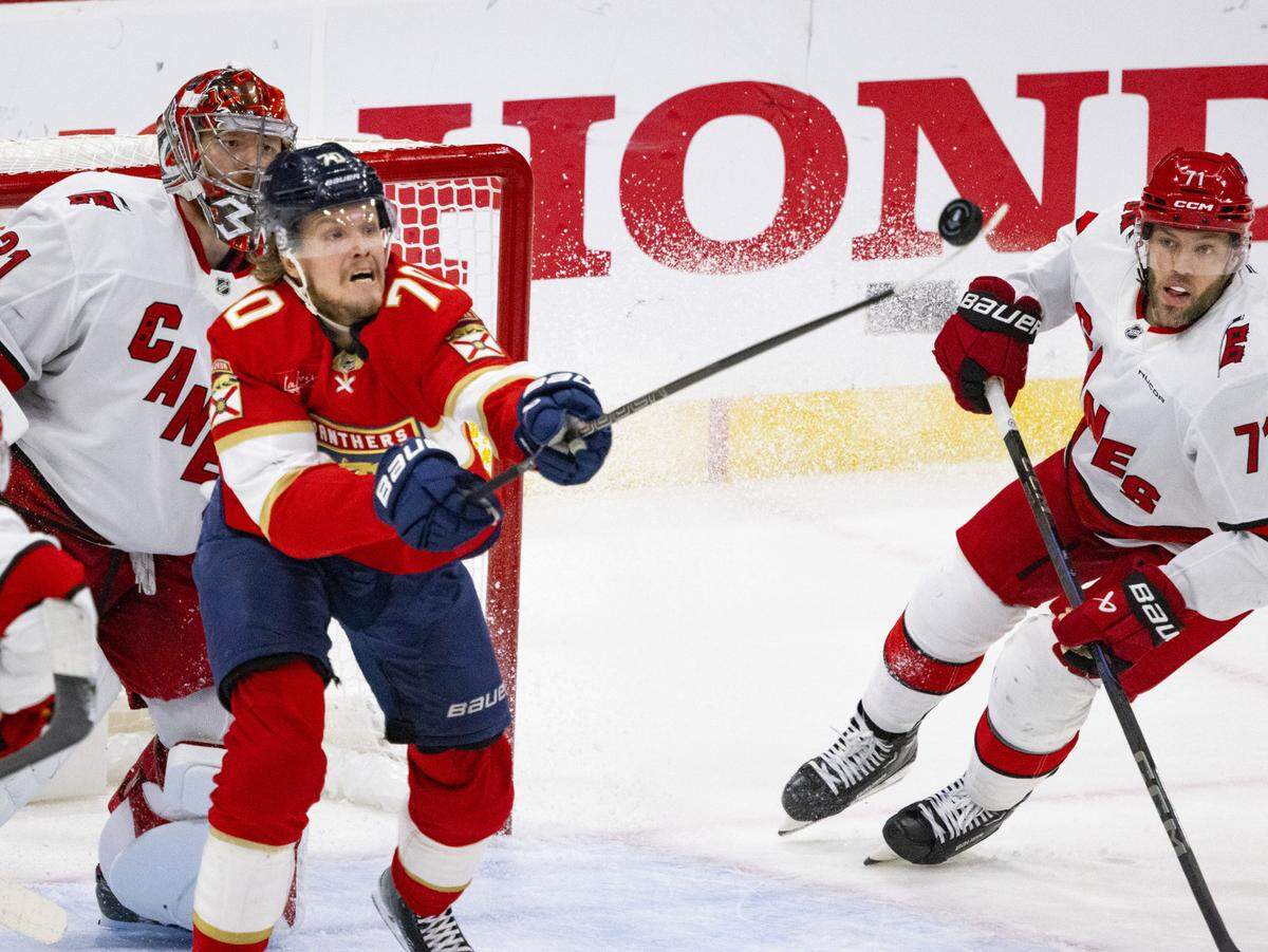 Florida Panthers center Jesper Boqvist (70) reaches for the puck in the third period of Game 4 during the Eastern Conference final of the NHL Stanley Cup playoffs against the Carolina Hurricanes at the Amerant Bank Arena on Monday, May 26, 2025 in Sunrise, Fla. The Carolina Hurricanes won 3-0. 