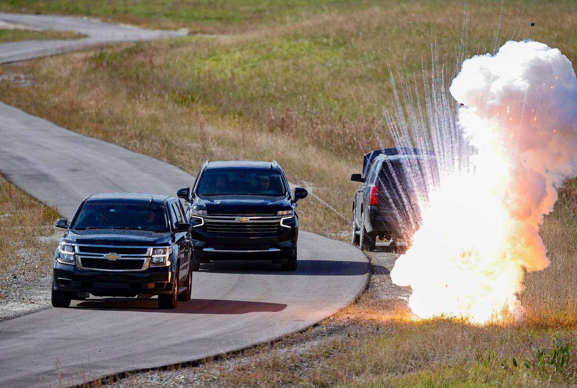 An explosion goes off near an SUV carrying a “high-value” target during a training exercise that involved U.S. State Department special agents and local law enforcement officers in Doral.