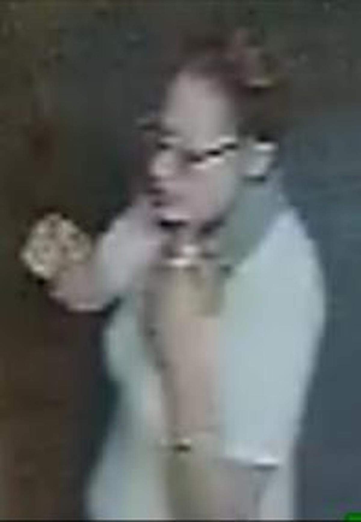 A surveillance video still of a suspect in the Aug. 21 purse theft