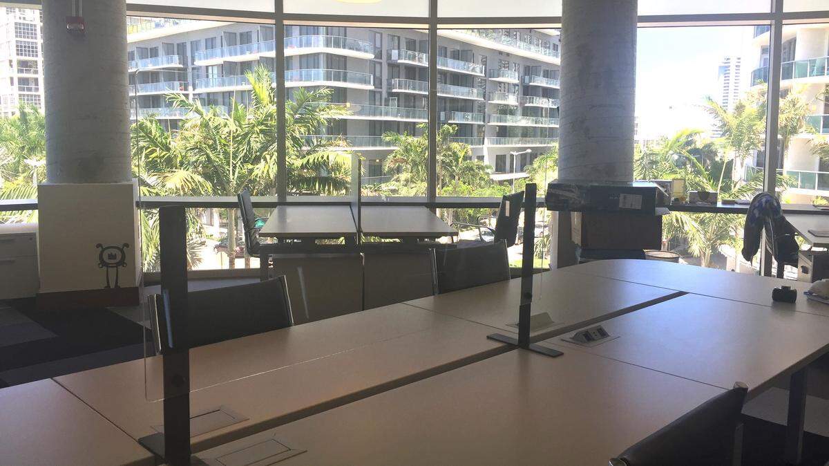 The co-working company ordered 35 plexiglass protective barriers for all of its six locations. It distributed them in select areas, including in this floating desk section at its Midtown location. 