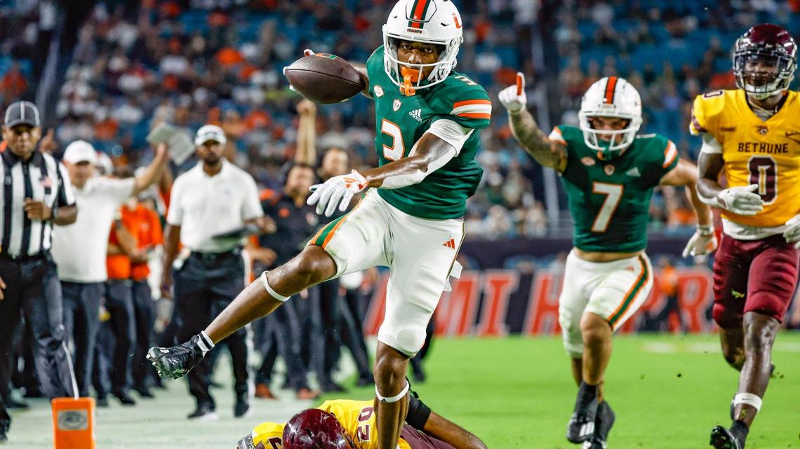 *Miami Hurricanes wide receiver Jacolby George (3) hopes over Bethune Cookman Wildcats defender Bethune cornerback Shelton Quarles Jr. (20) on his way to score in the second quarter at Hard Rock Stadium in Miami Gardens, Florida on Thursday, September 14, 2023.