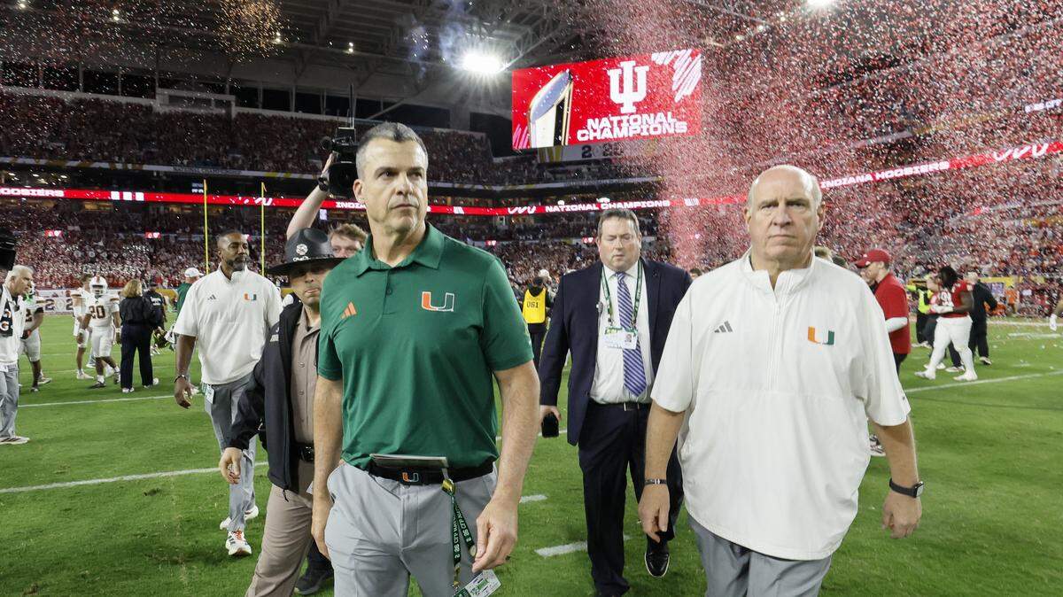 Miami Hurricanes head coach Mario Cristobal walks off the field after the Indiana Hoosiers defeat the Canes in the College Football Playoff National Championship Game at Hard Rock Stadium in Miami Gardens, Florida, on Monday, January 19, 2026.
