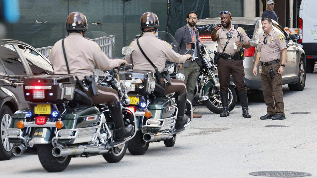 Police officers arrive at Ryder Trauma Center at Jackson Memorial Hospital after two Miami police officers were shot while responding to a call on a shooting on Thursday morning, Oct. 9, 2025, in Allapattah. The injured officers were taken to the trauma center, where they were in ‘good spirits,’ according to Miami Police Chief Manuel Morales, who visited them there.