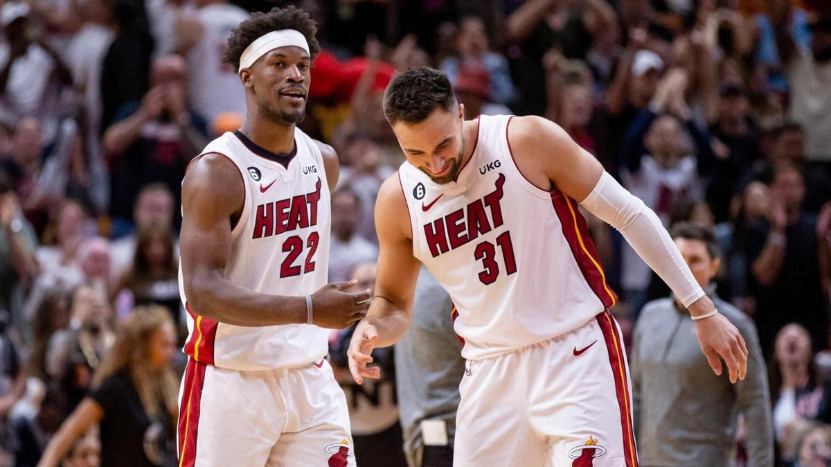 Miami Heat forward Jimmy Butler (22) and teammate Max Strus (31) react during the second half of an NBA play-in tournament game against the Chicago Bulls at Kaseya Center in Downtown Miami, Florida, on Friday, April 14, 2023.