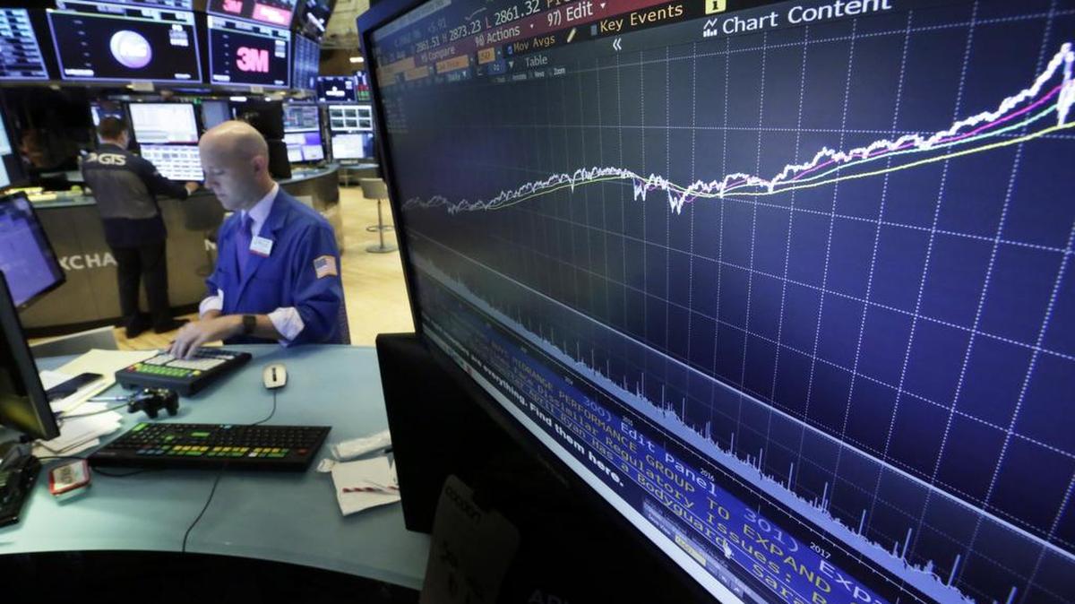 A chart on a screen on the floor of the New York Stock Exchange shows the rise of the S&P 500 index since 2009. Heading into the beginning of the third-quarter reporting period, the S&P 500 stock index is hovering near new highs.