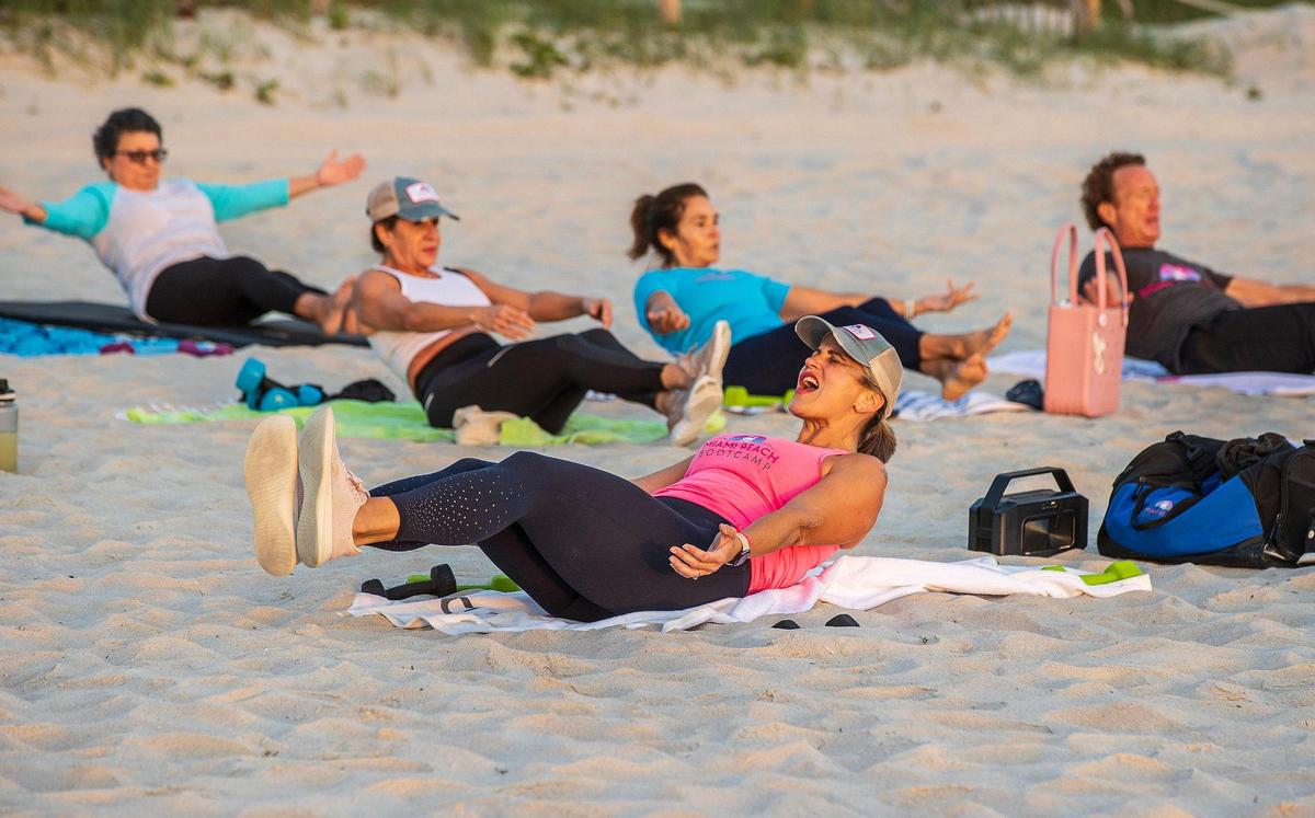 Certified personal trainer and fitness coach Kristen Smith leads an early-morning class on Tuesday, Jan. 23, as part of her Miami Beach Fit Camp program. She used to weigh 405 pounds and has lost more than 240 pounds since 2006. She will run her first Life Time Miami Marathon on Sunday, January 28th.