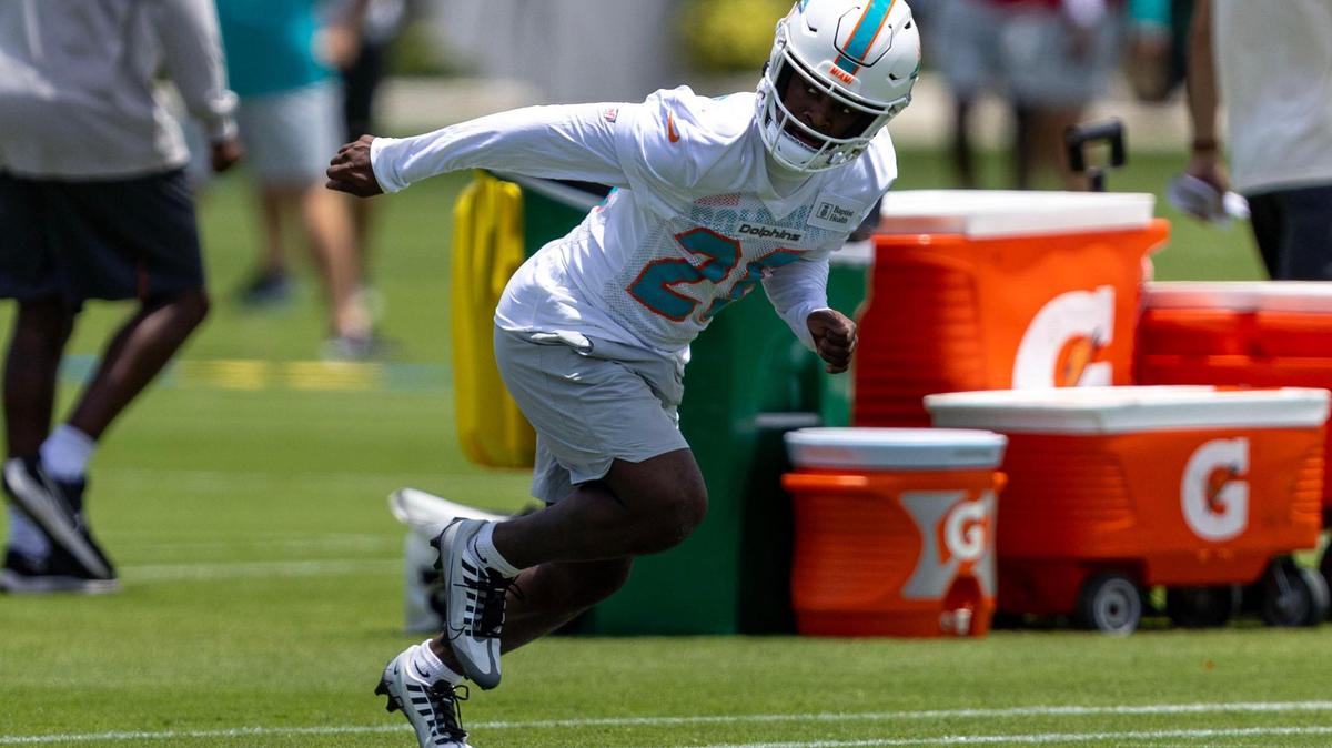 Rookie running back Devon Achane (28) warms up as he sprints during 2023 Miami Dolphins Rookie Minicamp practice at Baptist Health Training Complex in Miami Gardens, Florida, on Friday, May 12, 2023.