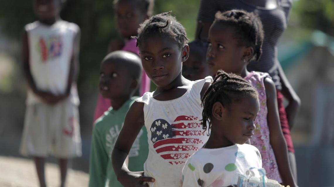 A group of children checks out visitors at the Teren Toto camp in Haiti.
