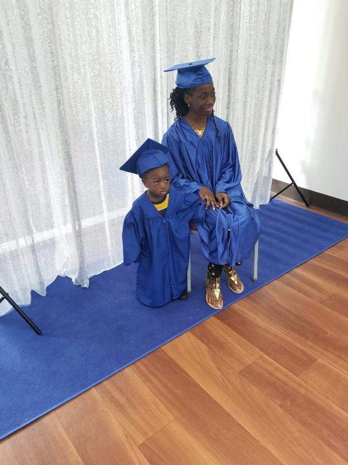 Alysha Princess Cesaire, graduating from a program with Elijah.