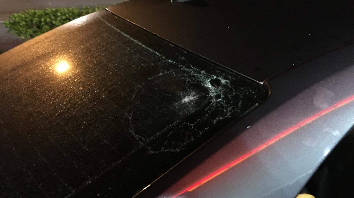 This gray vehicle with gunfire damage to its windshield was caught in the crossfire of an early morning shootout on the Palmetto Expressway, according to the Florida Highway Patrol.
