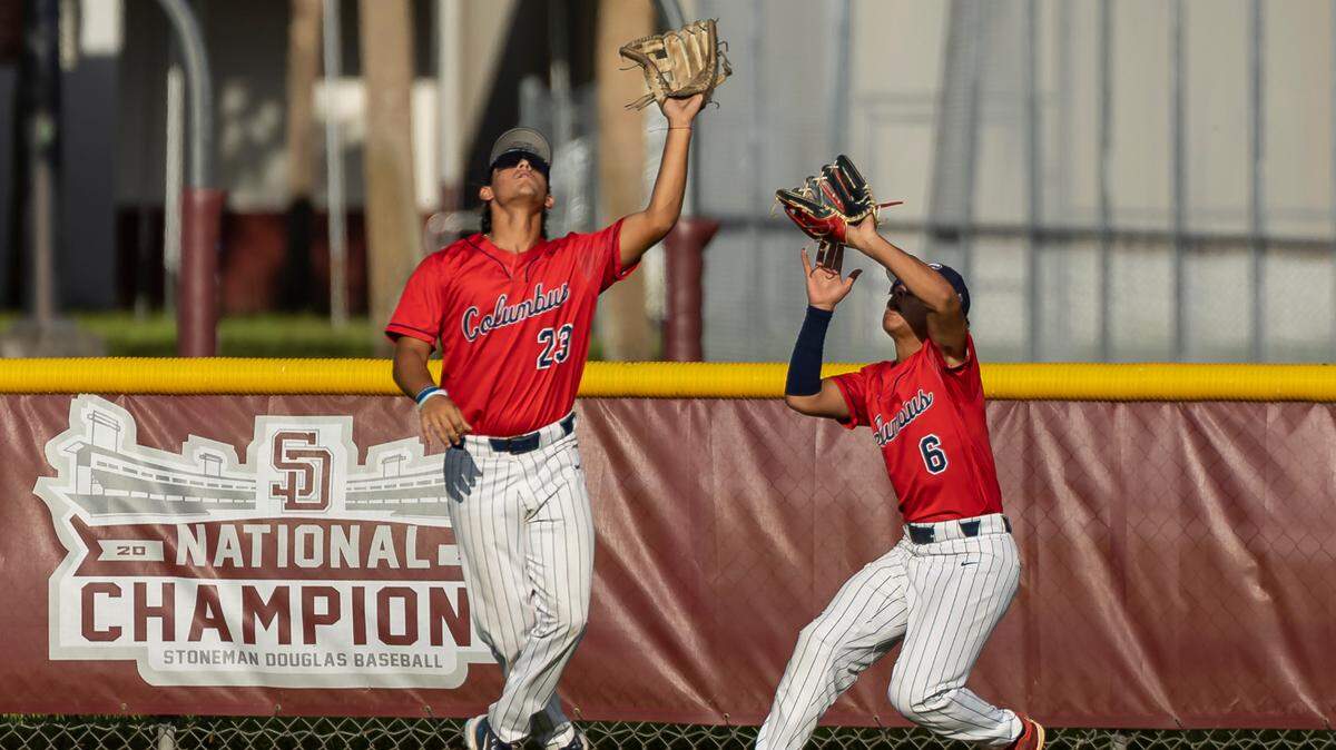 Christopher Columbus’ Frank Francisco (23) catches a fly ball from Marjory Stoneman Douglas’ Rylan Lujo (14) in the first inning of their Region 4-7A baseball game final at Anthony Rizzo Field on Tuesday, May 16, 2023, in Parkland, Fla.