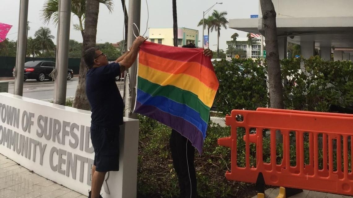 The LGBTQ Pride flag is raised outside the Surfside Community Center in July 2021.