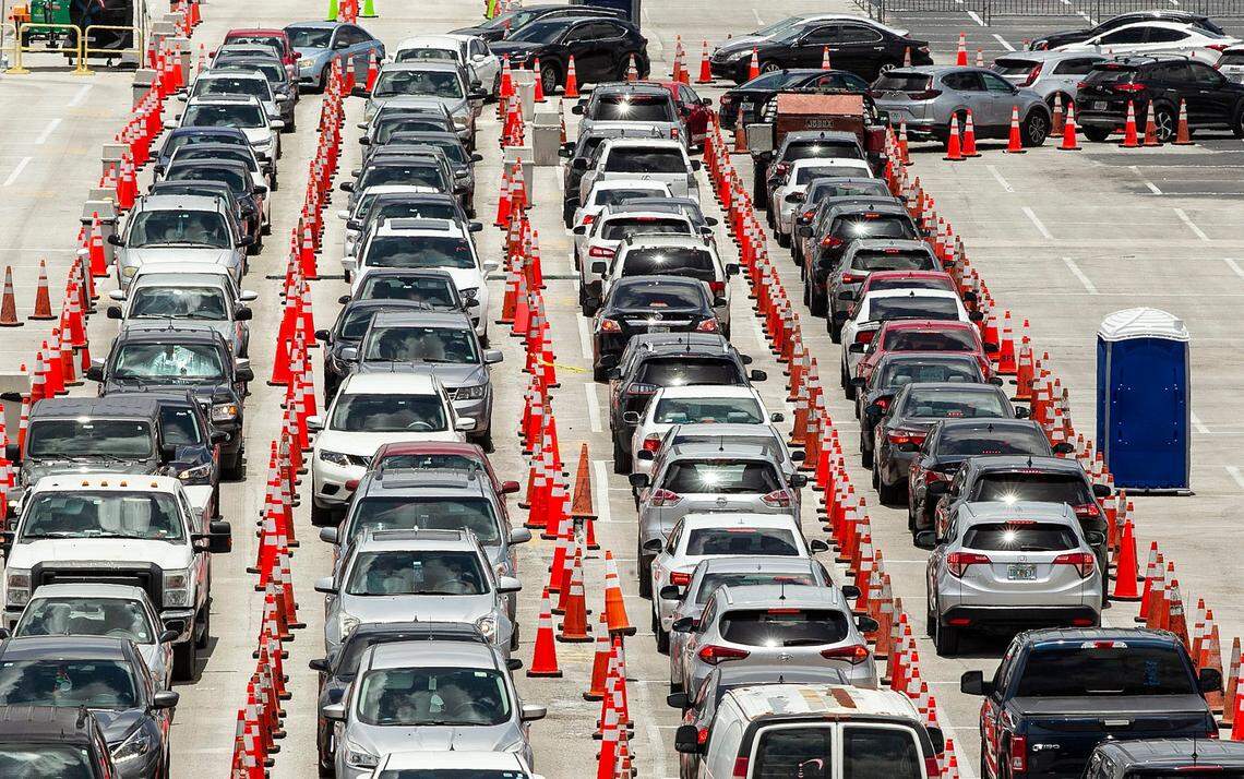 Long Lines are seen outside of the Hard Rock Stadium test site on Thursday, June 25, 2020, as coronavirus numbers surge in Miami-Dade County.