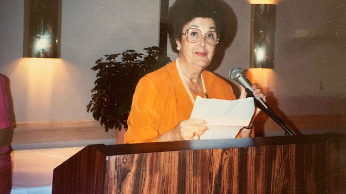 Family photo of Ruth Karp addressing the University of Miami’s Hurricane Club.