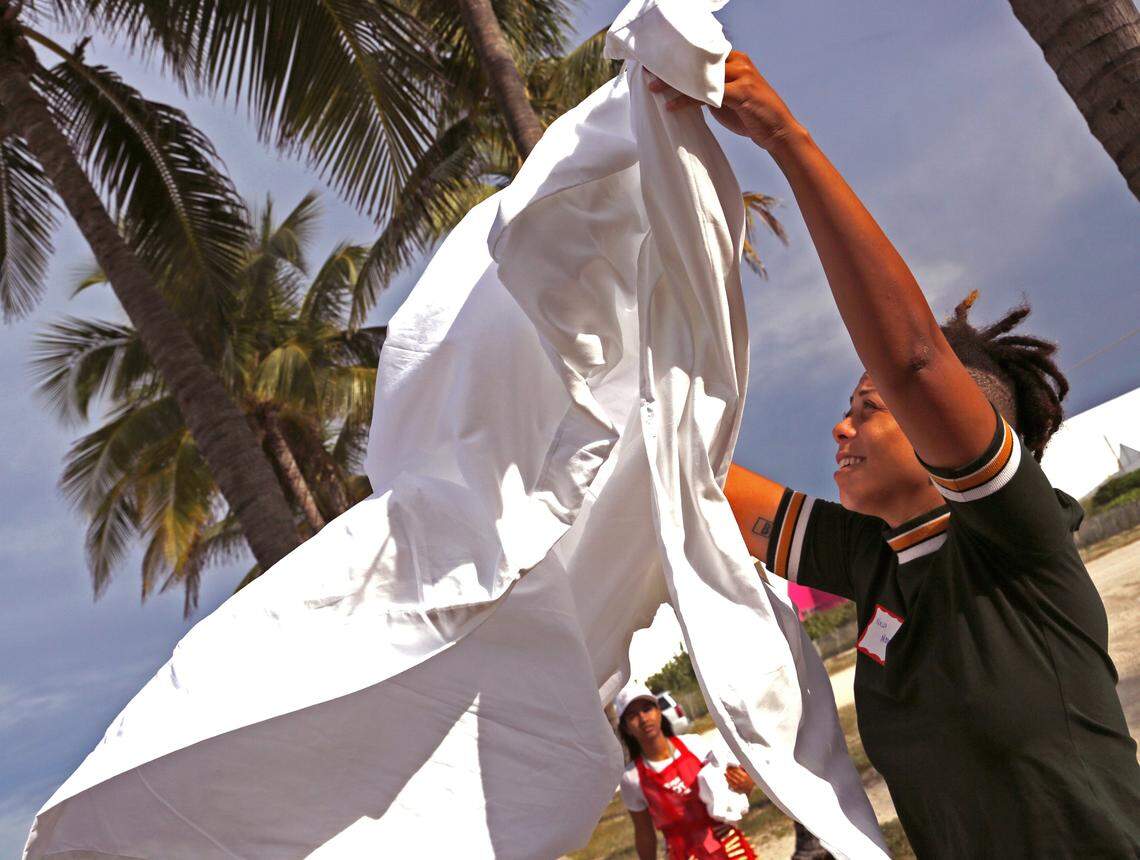 Artist Najja Moon participates in the performance piece “Never Not Working” that conveys the daily hard work of housekeepers during the Miami’s Art Week kicked off at “UNTITLED,” 12th and Ocean Drive as Miami’s Art Week kicks off on Tuesday, December 4, 2018.