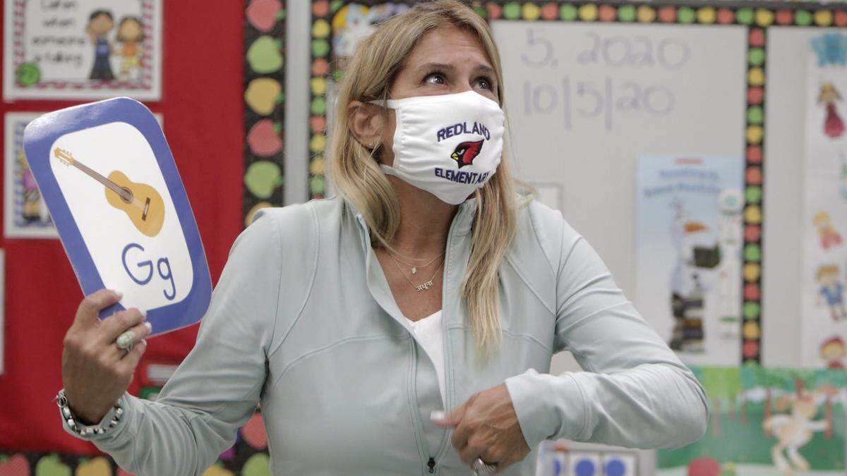 Kindergarten teacher Sarita Sanmiguel teaches the alphabet at Redland Elementary on Monday, Oct. 5, 2020. It’s the first day of school re-openings for Miami-Dade Public Schools. On Monday, only students in pre-k, kindergarten and first grade were welcomed back to schools. The remaining students whose parents opted for them to return to school will return to classrooms on Wednesday and Friday.