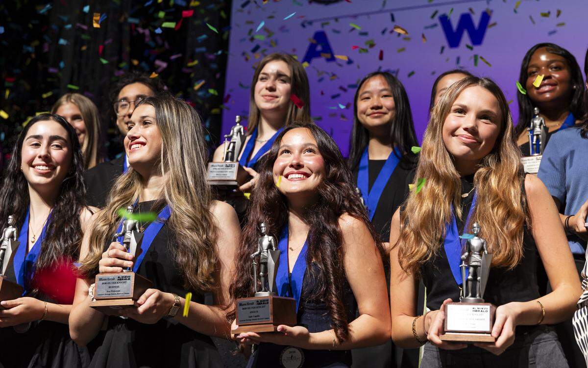 Silver Knight winner in Speech, Jade Capella, from American Heritage Schools, center, celebrates on stage with fellow recipients after receiving their awards during the Miami Herald & el Nuevo Herald 68th Silver Knight Award Ceremony at the James L. Knight Center.